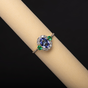 Gold ring with tanzanite, emerald, diamonds.